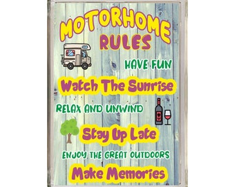 May include: A light blue sign with a woodgrain background and white text that reads "Motorhome Rules". The sign features a cartoon motorhome, a wine bottle and glass, a tree, and the text "Have Fun", "Watch The Sunrise", "Relax And Unwind", "Stay Up Late", "Enjoy The Great Outdoors", and "Make Memories".