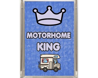 May include: A blue and white magnet with a crown, the text "MOTORHOME KING" and a cartoon image of a motorhome.