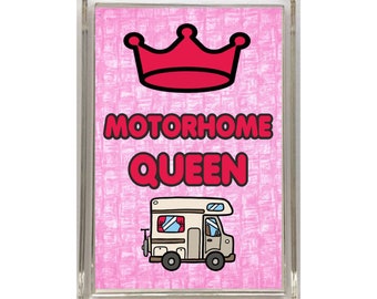 May include: A pink and white patterned magnet with a red crown and the text "Motorhome Queen". A cartoon image of a motorhome is below the text.