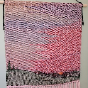 Large woven tapestry pink sky landscape,  handwoven wall hanging, textile fiber art of sunset over green rolling hills