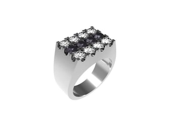 May include: A silver ring with a rectangular design featuring black and white gemstones.