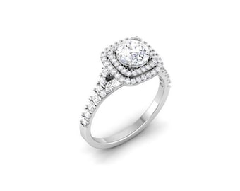 May include: A silver engagement ring with a round center stone surrounded by two rows of smaller stones. The ring has a split shank with smaller stones on each side.