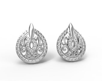 Peut inclure: Une paire de boucles d'oreilles en argent de forme goutte d'eau avec un motif floral délicat. Les boucles d'oreilles sont ornées de petites pierres précieuses claires.