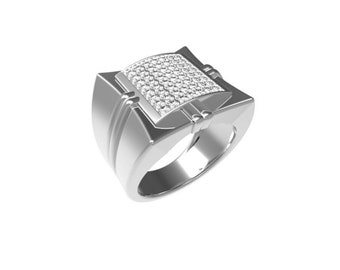 Può includere: Un anello d'argento con una parte superiore quadrata incastonata con piccole pietre trasparenti.
