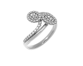 May include: A silver ring with two oval-shaped settings, each set with a cluster of small diamonds. The ring band is also set with small diamonds.