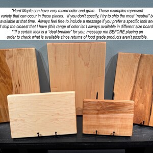 May include: Five rectangular hard maple wood cutting boards of varying sizes and grain patterns, ranging from light cream to reddish-brown tones. The text overlay explains that hard maple can have mixed color and grain variations.