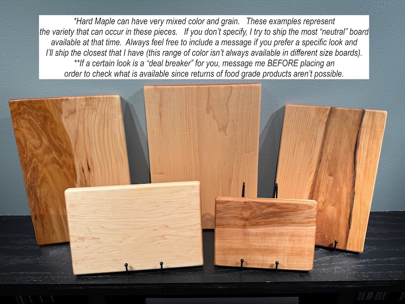 May include: Five rectangular hard maple wood cutting boards of varying sizes and grain patterns, ranging from light cream to reddish-brown tones. The text overlay explains that hard maple can have mixed color and grain variations.