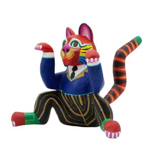 Alebrije wise cat, Mexican wood carving handicraft by Antonio and Saulo Mandarin