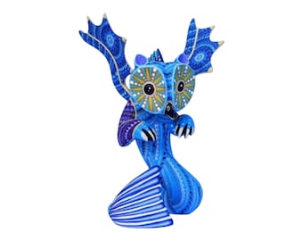 May include: A handcrafted blue owl figurine with intricate patterns and details. The owl features large, expressive eyes with yellow and white accents, and stylized wings. The figurine is a unique piece of folk art.