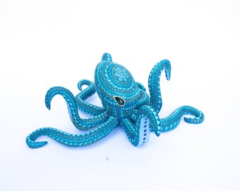 Pulpo tallado en madera, escultura coleccionable de animal fantástico.