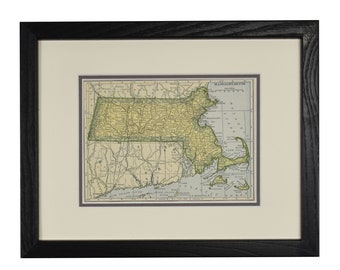 May include: A vintage map of Massachusetts, framed in black wood. The map shows the state's counties, cities, and towns, as well as major roads and railroads. The map is printed in shades of green, blue, and brown.