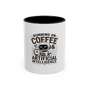 May include: A white ceramic mug with a black interior and rim, featuring a graphic of a small robot holding a coffee cup. The text reads RUNNING ON COFFEE & ARTIFICIAL INTELLIGENCE, with the letters AI displayed on the robot's chest plate.