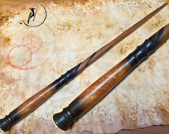 Varita mágica hecha de madera rizada de Afzelia y nogal.