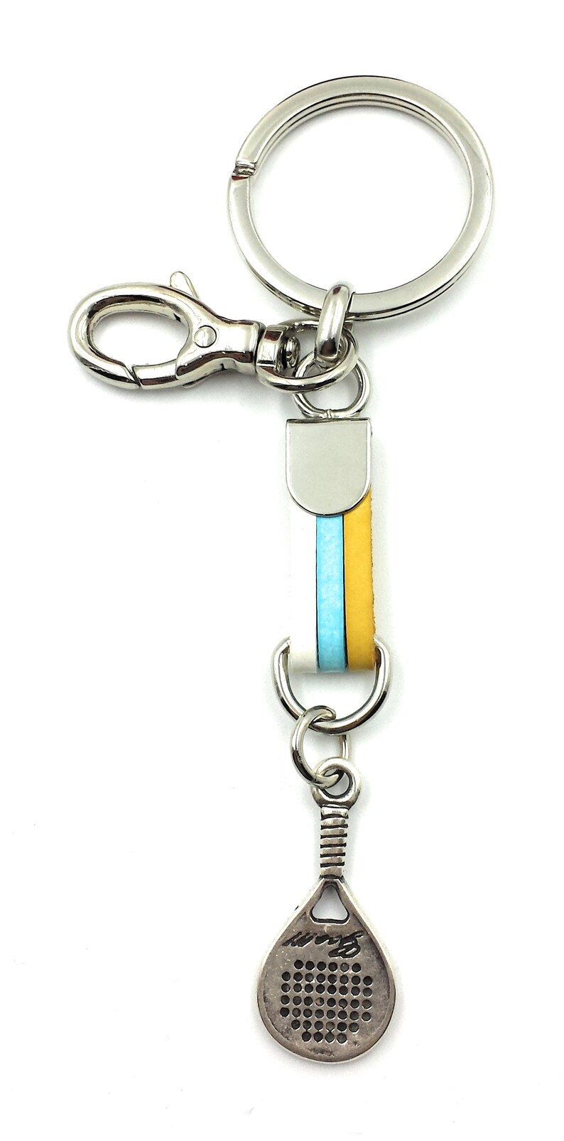 May include: A silver key chain with a blue and yellow striped leather strap and a silver paddle shaped charm.