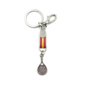May include: A silver key chain with a red and yellow leather strap and a silver padel racket charm.