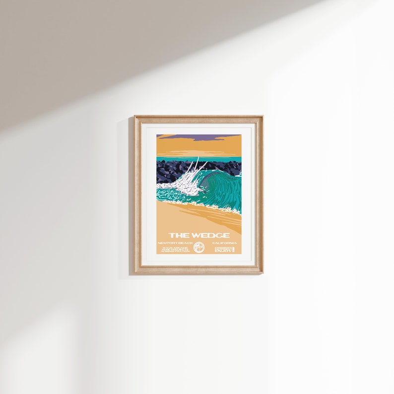 May include: A vintage-style poster with a graphic illustration of a large wave breaking at The Wedge in Newport Beach, California. The poster is framed in a light wood frame.