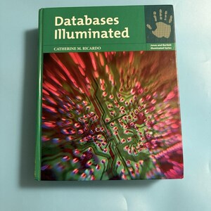 May include: A hardcover textbook titled Databases Illuminated by Catherine M. Ricardo. The green cover features a graphic of a circuit board with a motion-blur effect in red and purple tones, and a small handprint icon in the upper right corner.