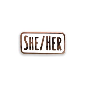She/Her pronoun enamel pin badge on white background