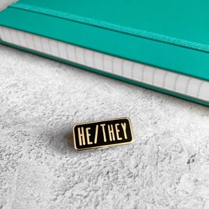 He/They Pronoun Hard Enamel Pin Badge - Black and Gold or White and Gold