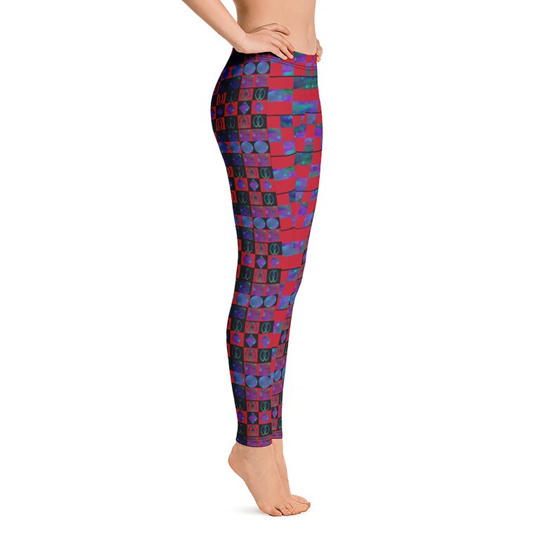 May include: Red and blue leggings with a geometric pattern of squares and circles. The leggings are made of a stretchy, comfortable fabric.