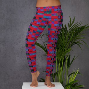 May include: Red, blue, and black patterned leggings with a geometric design. The leggings are made of a stretchy, comfortable fabric.
