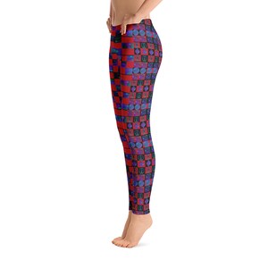 May include: Red and black leggings with a checkered pattern and blue and purple geometric shapes.