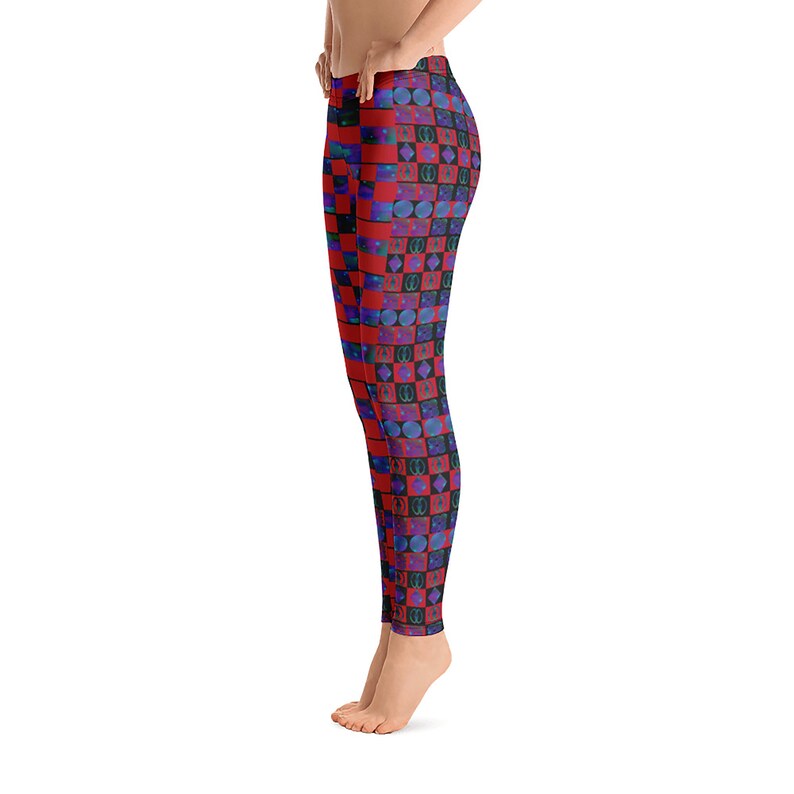 May include: Red and black leggings with a checkered pattern and blue and purple geometric shapes.