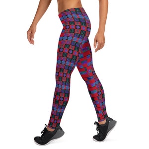 May include: Red and blue patterned leggings with a geometric design. The leggings are made of a stretchy, comfortable fabric and are perfect for yoga, running, or any other workout.