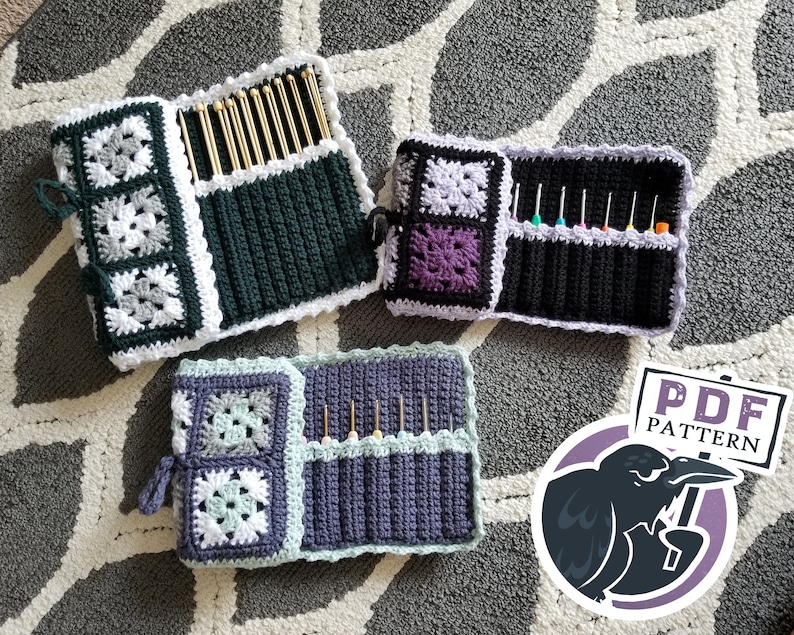 May include: Three crocheted needle cases with different color combinations. The cases are made with a granny square pattern and have a flap that closes with a button. The cases are filled with knitting needles. The image also includes a sticker with the text "PDF PATTERN" and a cartoon crow.