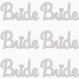 May include: Six silver "Bride" word stickers. Each word is spelled out in a cursive font and is embellished with small, round, pearl-like beads. A small heart shape is used to dot the "i" in each word.