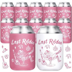 May include: A collection of pink and white can coolers with the text "Last Rodeo" in a script font. The coolers feature a cowgirl illustration in a martini glass, with additional graphics of a guitar, cowboy hat, and disco ball.