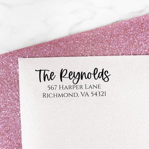 May include: A white return address label with black text that reads "The Reynolds, 567 Harper Lane, Richmond, VA 54321".