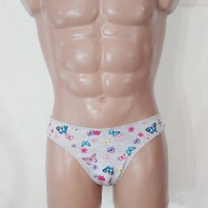 May include: Grey underwear with a butterfly and floral print.