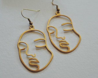 Boucles d’oreilles de silhouette de visage