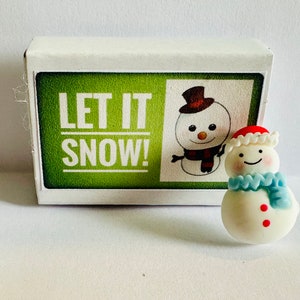 Qu'il neige ! Alternative aux cartes de voeux Mini bonhomme de neige dans une boîte