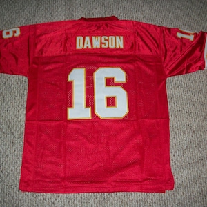 May include: Red football jersey with white and gold trim. The number 16 is on the back with the name DAWSON above it.