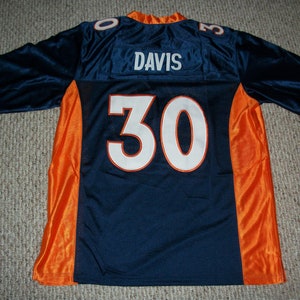 May include: A blue football jersey with orange accents. The jersey has the name "DAVIS" and the number "30" on the back.