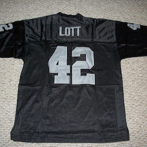 RONNIE LOTT Unsigned Custom Oakland Sewn Black Football Jersey Sizes S-3XL