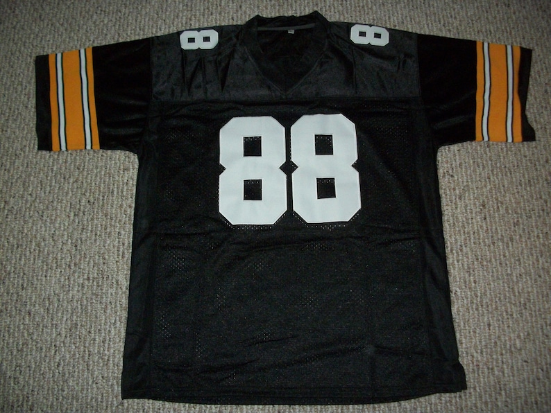 May include: Black football jersey with orange and white stripes on the sleeves and the number 88 in white on the front.