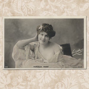 Actress Marcelle Yrven relaxing on sofa - Vintage French photo postcard from the early 1900's.