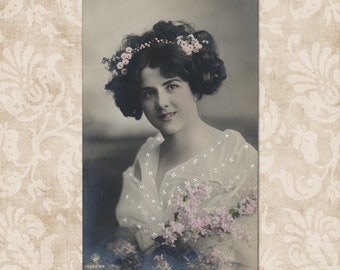 Lovely romantic lady with flowers in her hair - Original vintage postcard from the early 1900's.