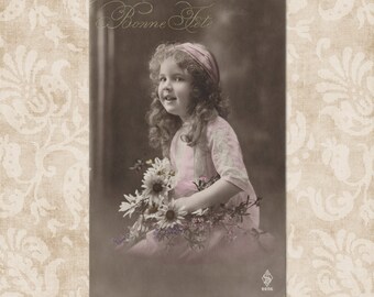 Cute curly girl with flowers - Original vintage French postcard from the early 1900's.