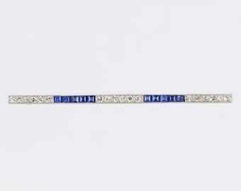 Broche de platino con zafiro y diamantes