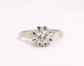 Antique solitaire in gold, platinum and old cut diamond 0.8 ct