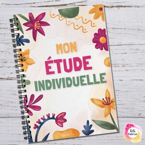 May include: Spiral-bound notebook with a floral design. The cover features the text "MON ÉTUDE INDIVIDUELLE" in orange, pink, and green. The notebook is decorated with colorful flowers and leaves. The background is a watercolor wash.