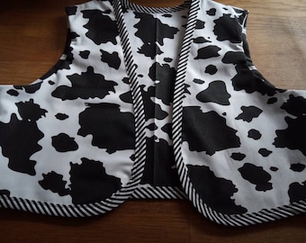 Chaleco con estampado de vaca, forrado, disponible con o sin ribete de rayas.