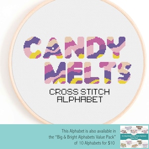 Puede incluir: Un diseño de punto de cruz en un aro de madera muestra las palabras "CANDY MELTS" en una fuente colorida y estampada. Debajo, el texto "CROSS STITCH ALPHABET" se muestra en una fuente simple y negra. Texto adicional menciona un paquete de valor.
