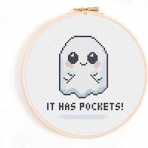 May include: Cross stitch pattern featuring a cute cartoon ghost with the text "IT HAS POCKETS!"