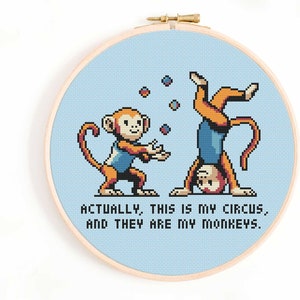 May include: Cross stitch pattern featuring two monkeys, one juggling balls and the other standing on its hands. The text reads "Actually, this is my circus, and they are my monkeys."
