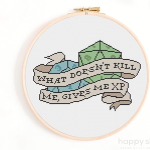 May include: A cross-stitch pattern featuring a banner with the text "What doesn't kill me, give me XP" and a stack of dice.